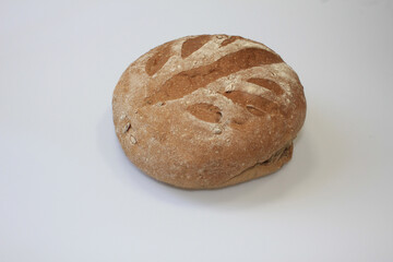 round artisanal loaf of bread, rustic artisan loaf, feature a crusty golden exterior dusted lightly with flour, traditional bakery products, bread, this round crusty bread isolated on white background
