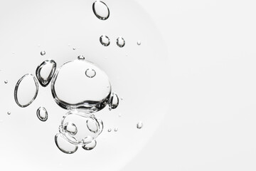 Face hyaluronic acid serum or gel background. Collagen gel or lubrication texture with copy space for design. Wellness and beauty concept.