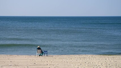 Solitary beach relaxation by ocean