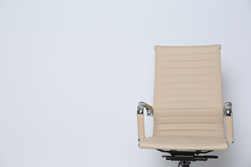 Comfortable office chair on white background, space for text