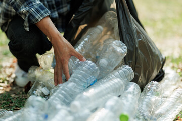 Collecting plastic bottle waste for recycling to help reduce pollution and combat global warming.
