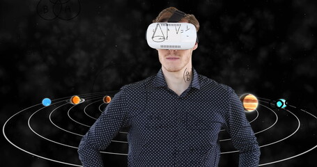 Image of businessman wearing vr headset over equations and solar system