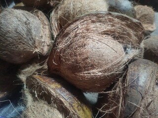  collection of partially peeled coconuts