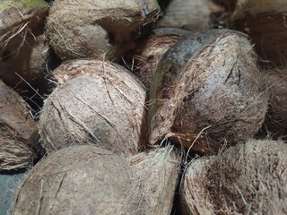 A collection of partially peeled coconuts
