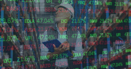 Image of financial data processing over man working in warehouse