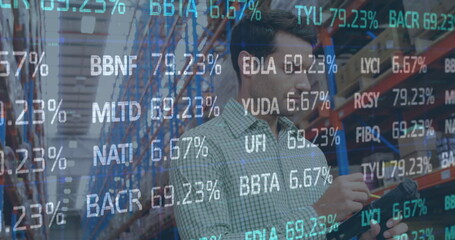 Image of financial data processing over man working in warehouse