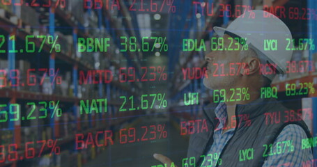 Image of financial data processing over man working in warehouse