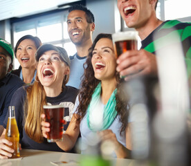 Pub, sports and group of excited fans with beer watching soccer match with happiness for winning goal. Support, alcohol and friends streaming broadcast television of football game for league in bar.