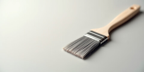 Minimalist paintbrush on gray background - art and design inspiration for creativity
