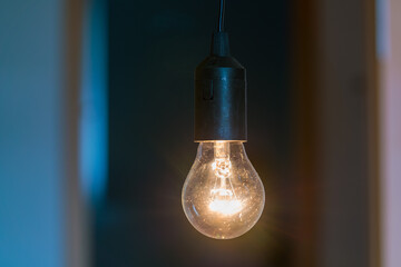 Vintage incandescent bulb in dark room