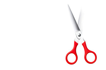 A pair of scissors with red handles on a black background angled right