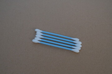Several light-blue tipped cotton swabs