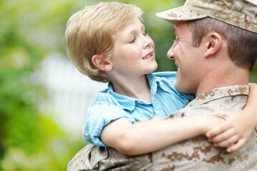 Outdoor, soldier and reunion with boy, smile and excited for dad, hug or hero with love of kid. Family, father and parent from military, embrace and care for child, portrait and man after war or home