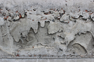 Streams of hardened cement mortar on a solid concrete surface 
