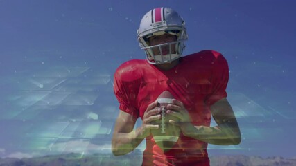 American football player holding ball with digital data processing animation overlay - Powered by Adobe