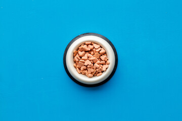Food and treats for pets - biscuits in a shape of heart in a bowl