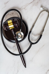 A judge's gavel and a physician's stethoscope. access and entitlement to health care regardless of race, religion, ethnicity, socioeconomic status