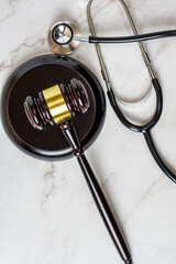 A judge's gavel and a physician's stethoscope. access and entitlement to health care regardless of race, religion, ethnicity, socioeconomic status