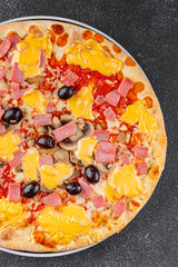 Pizza ham, mushrooms, olives, cheese appetizer vegetable dish fresh delicious gourmet food background on the table rustic food top view copy space