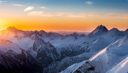 sunset over snowy mountain range