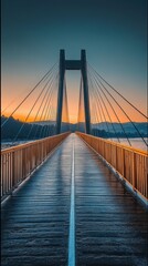 Obraz premium Sunrise over a cable-stayed bridge, wooden walkway, calm river, distant mountains