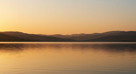 Serene Sunset Landscape Golden Hour Over Calm Lake and Distant Mountains