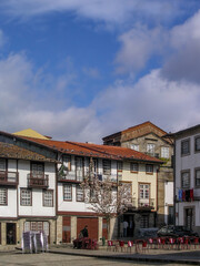 Guimaraes, Portugal. Medieval houses in Sao Tiago aka Santiago Square. Historical Center of Guimaraes. Unesco World Heritage Site