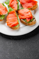 Salmon sandwich red fish seafood appetizer dish fresh tasty gourmet food background on table rustic food top view copy space 