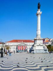 Lisbon, Portugal. Rossio Square or Dom Pedro IV Square. D. Pedro IV monument, D. Maria II Theater and Portuguese cobblestone pavement