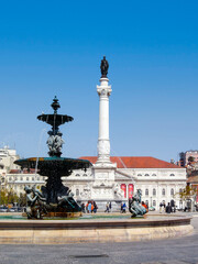 Lisbon, Portugal. Rossio Square or Dom Pedro IV Square. 19th century Bronze Fountain, D Pedro IV Monument and D Maria II Theater.