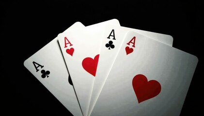 Fototapeta premium Four aces fanned out, high contrast, black background , high contrast, sequence, stock