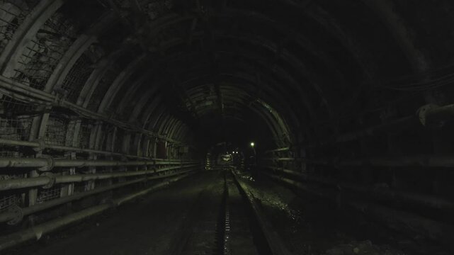 The wagon moving forward in coal mine.