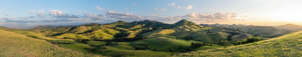 Fototapeta premium Vibrant landscape at sunset over rolling hills