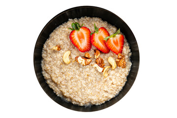 Oatmeal porridge strawberries nuts healthy breakfast appetizer dish fresh gourmet food background on the table rustic food top view copy space keto and paleo diet vegetarian and vegan food
