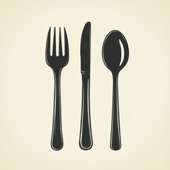 Cutlery arrangement featuring a fork, knife, and spoon on a simple background highlighting dining essentials and table settings