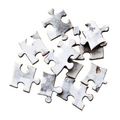 Scattered white puzzle pieces on a black background, representing problem solving, strategy, and challenge Concept of business, education, and teamwork
