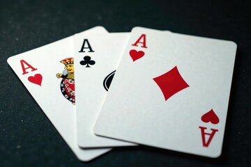 Obraz premium Playing cards arranged in a sequence showing the four aces , poker, royalty, gambling