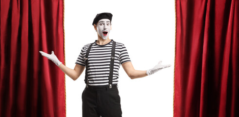 Mime gesturing welcome at a theatre