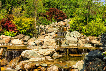 Multi-stage decorative waterfall on a stream in a public park