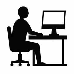 Silhouette of a person working on a laptop in an office