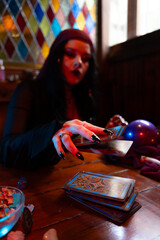 Fortune teller reading tarot cards in a mystical atmosphere