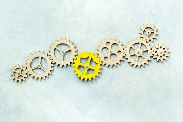 One cogwheel matches to chain of gears. New team member or new idea concept