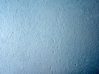Blue wall with a rough texture
