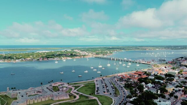Scenic drone footage of St. Augustine, Florida, showcasing its historic streets, Spanish colonial architecture, and charming coastal atmosphere. Ideal for travel documentaries, tourism content