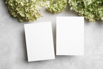 Wedding invitation card mockup with two paper cards, front and back sides, top view with copy space...