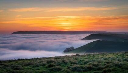 stunning landscape sunrise image of atmospheric cloud inversion over south downs escarpment