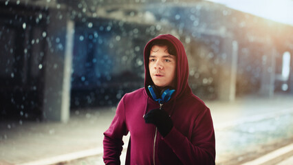 Young man running outdoors in winter
