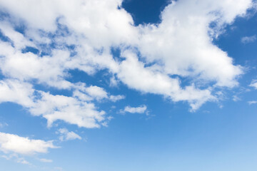 Beautiful clear blue sky with soft white clouds spread out