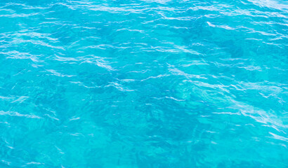 Vibrant clear blue ocean water displaying gentle ripples