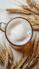 Overhead view of a chilled beer mug with thick foam surrounded by wheat stalks, showcasing freshness